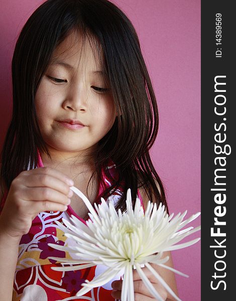 Little asian girl with flower