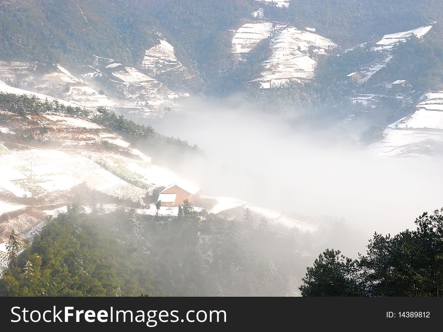 Mountain in the winter, a small house in the image. Mountain in the winter, a small house in the image