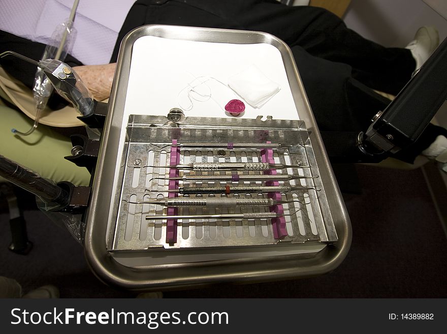 A tray full of hygienists instruments. A tray full of hygienists instruments.