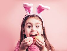 Cute Little Girl With Bunny Ears On Pink Background Stock Photo
