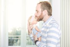 Man With A Doll Stock Photo