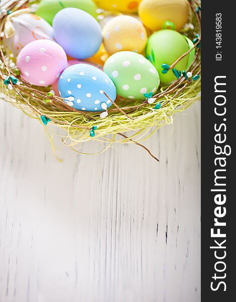Happy Easter. Congratulatory easter background. Easter eggs and flowers. Background with copy space. Selective focus