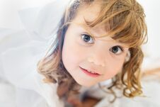 Adorable Little Girl Lying In The Bed And Smiling In The Early Morning Royalty Free Stock Photography
