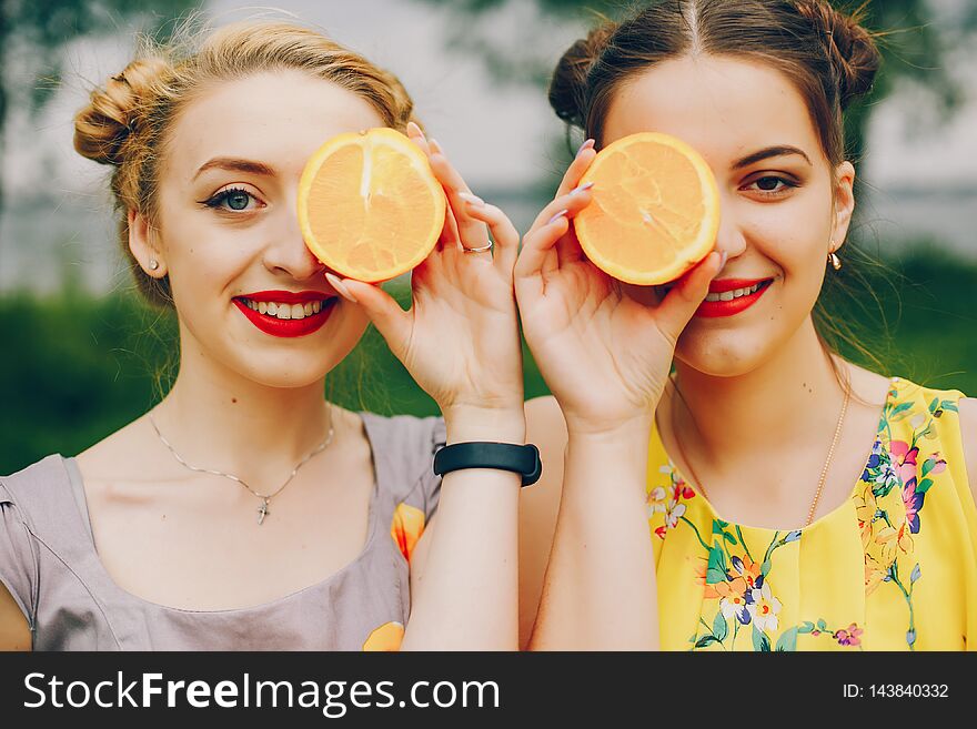 Two Pretty Girls In A Summer Park