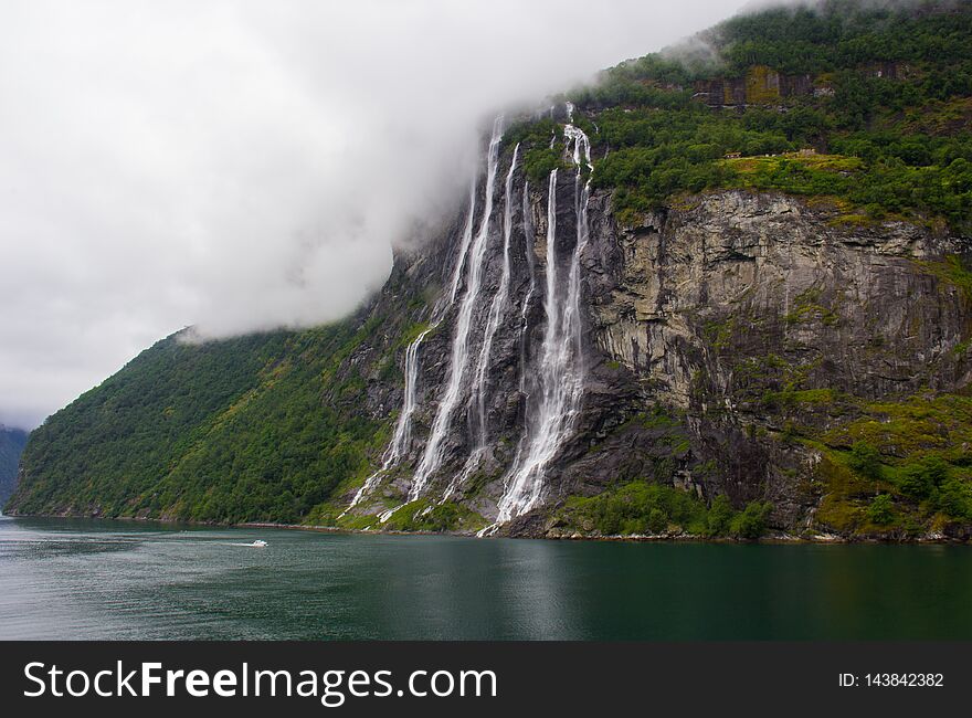 Waterfalls along the famous Geirangerfjord in western Norway. Waterfalls along the famous Geirangerfjord in western Norway.