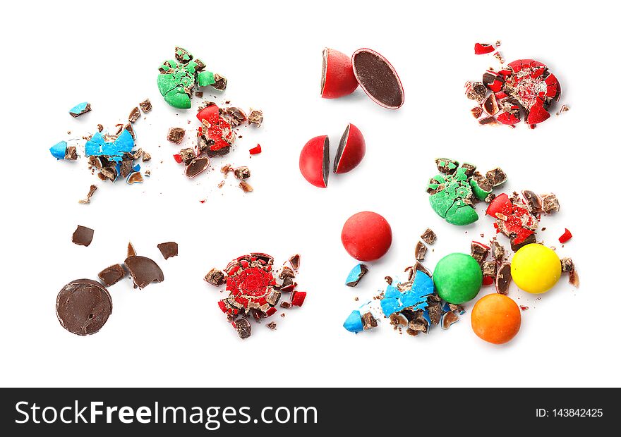 Set of crushed tasty colorful candies on white