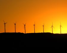 Windmills Isolated Against Sunset Royalty Free Stock Image