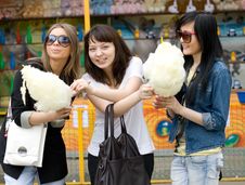 Three Girls Eating Candy Floss Stock Photo Three Girls Eating Candy Floss Stock Photo