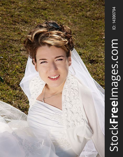 Young beautiful smiling woman, bride, outdoor shot