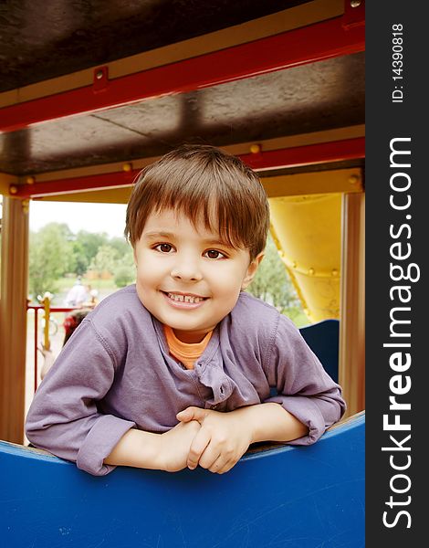 Portrait of beautiful smiling little boy on adventure playground, outdoor shot. Portrait of beautiful smiling little boy on adventure playground, outdoor shot