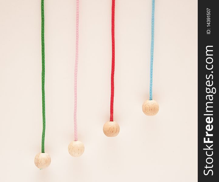 Hanging colour laces with wooden round tips