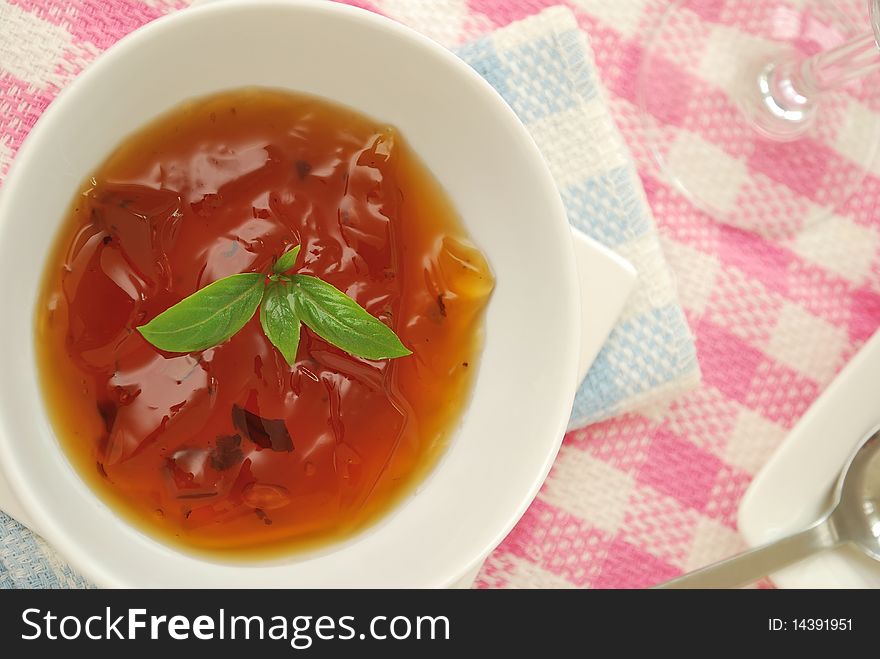 Sweet and refreshing Oriental jelly dessert made from healthy Chinese herbal ingredients on pink background. For diet and nutrition, food and beverage, and healthy lifestyle concepts. Sweet and refreshing Oriental jelly dessert made from healthy Chinese herbal ingredients on pink background. For diet and nutrition, food and beverage, and healthy lifestyle concepts.