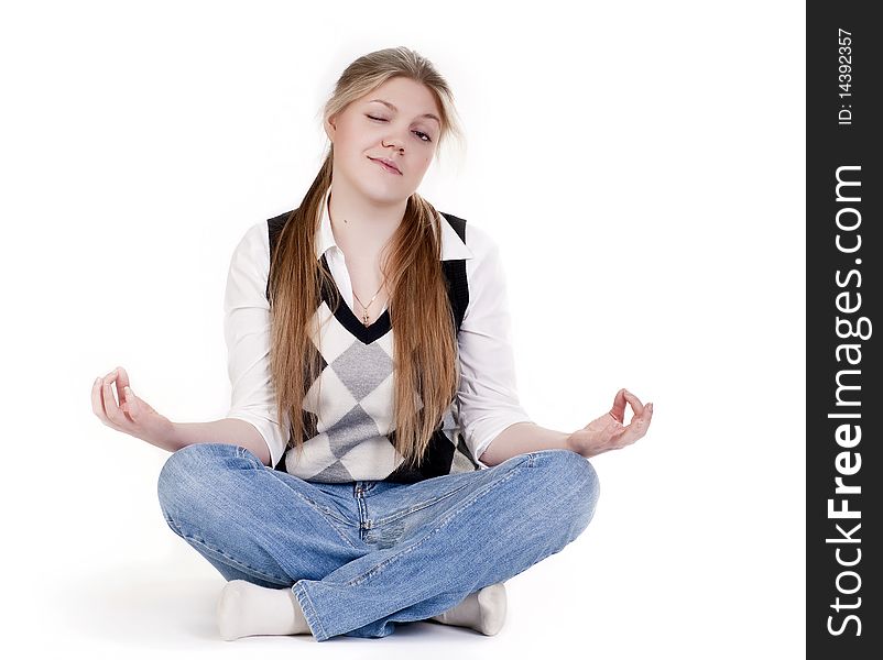 Blond woman meditating in lotus position isolated on white