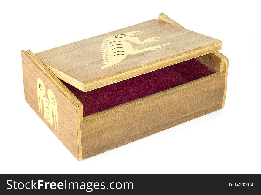 A handmade Ecuadorean box with inlaid stylized iguana, open to show the red felt interior. A handmade Ecuadorean box with inlaid stylized iguana, open to show the red felt interior