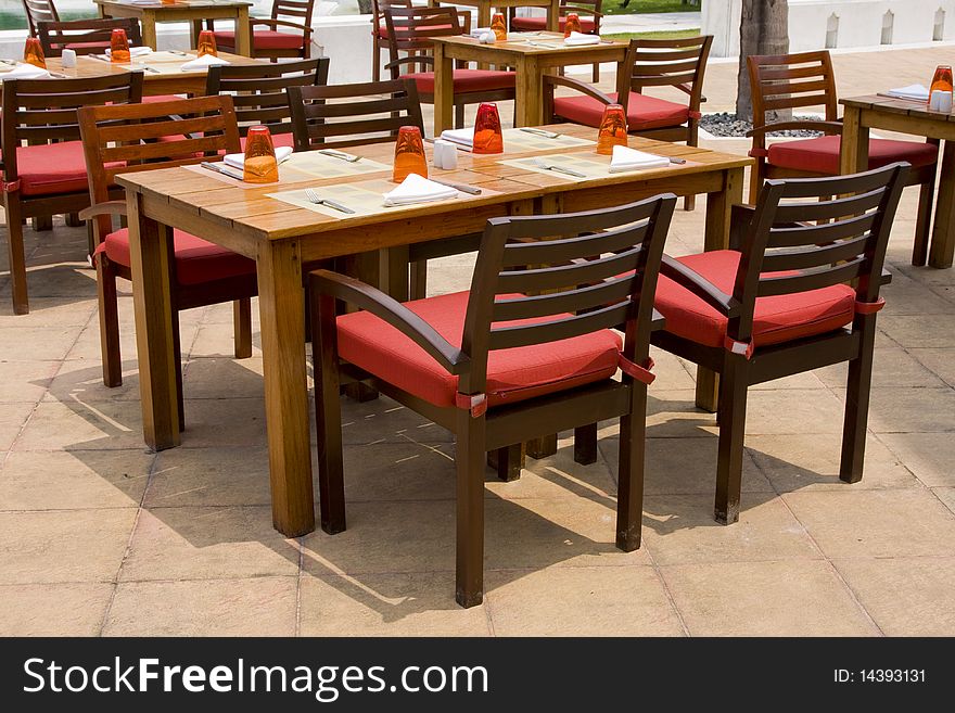 Rest on coast. Table and chairs on beach clear summer day.