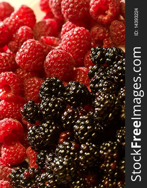 Food series: raspberry and blackberry close up texture