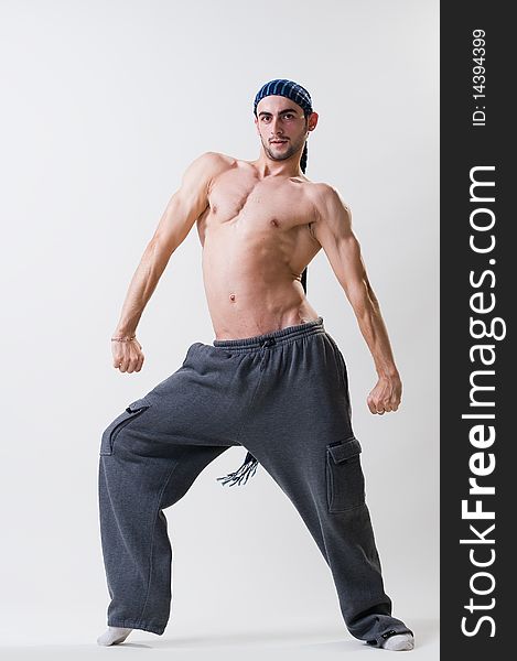 Young dancer exercising, studio shot