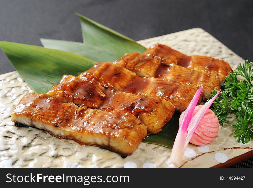 A fish restaurant row on white dish. A fish restaurant row on white dish