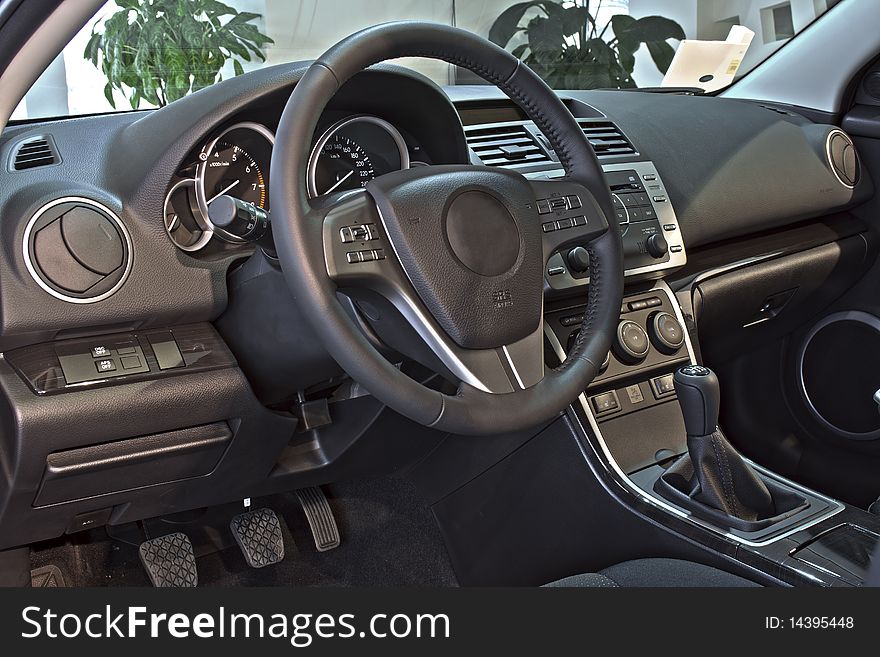 Steering wheel and instrument panel inside the car. Steering wheel and instrument panel inside the car