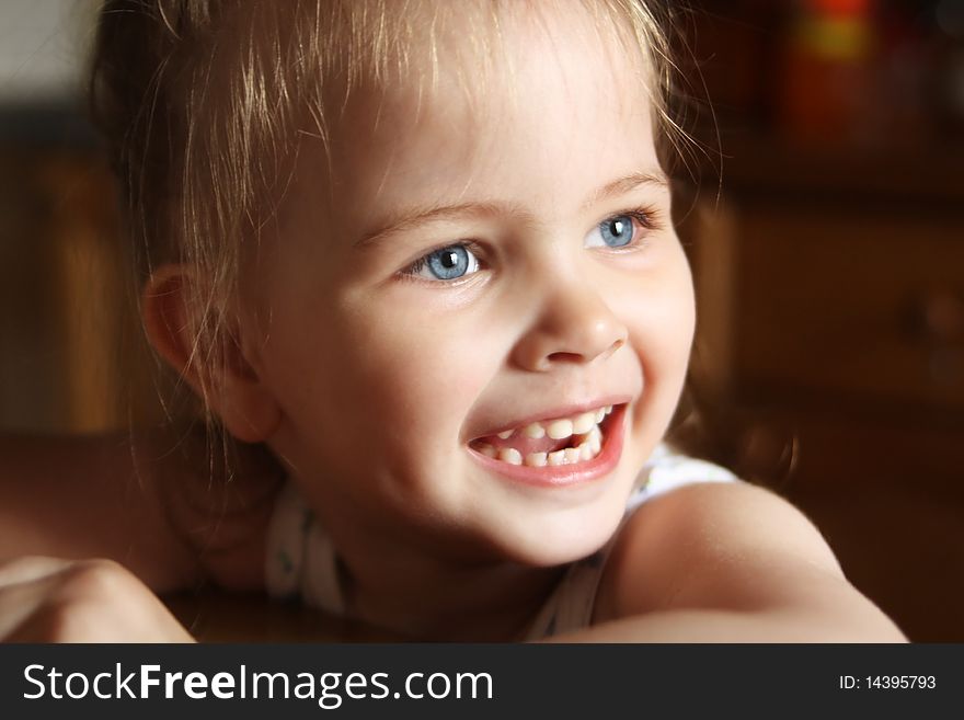 Beautiful little girl happily smiling closeup. Beautiful little girl happily smiling closeup