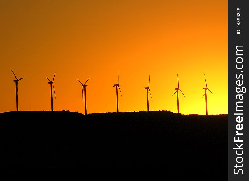 Windmills Isolated Against Sunset