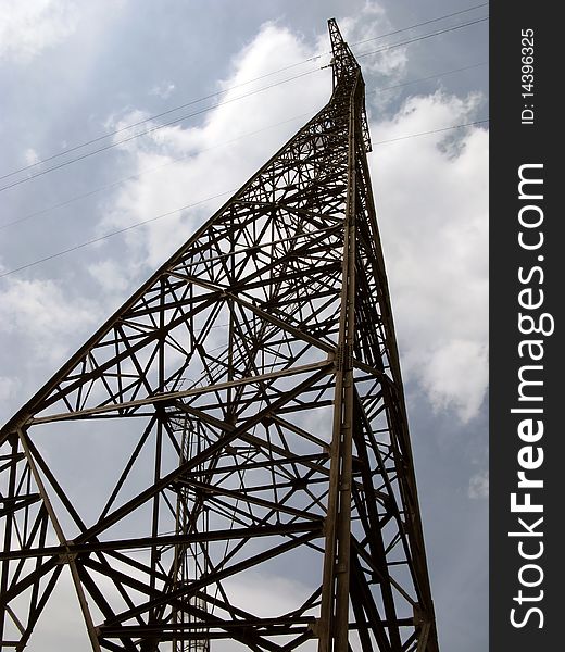 Electricity pylon against an intense blue sky