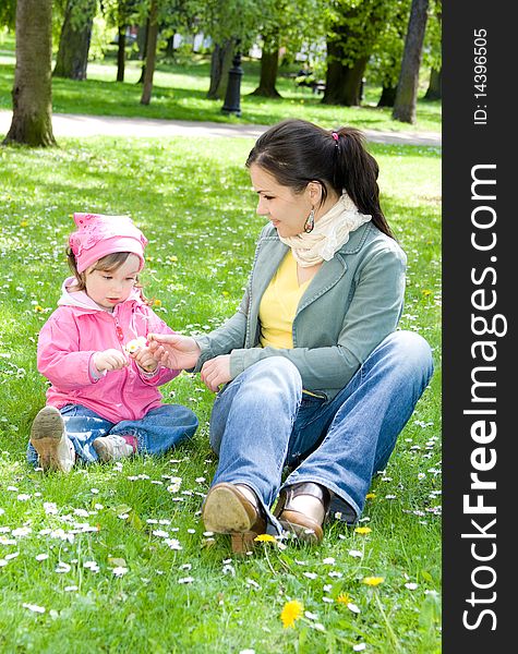 Sweet happy little girl in park