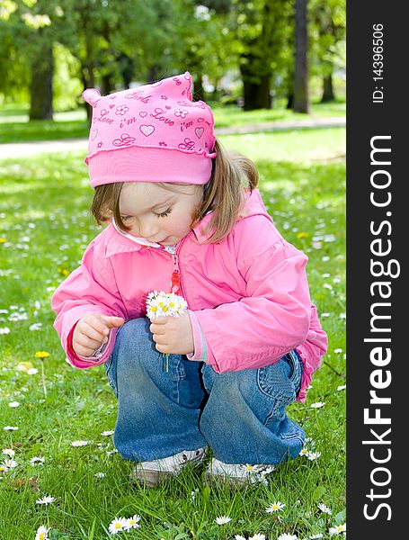 Sweet happy little girl in park