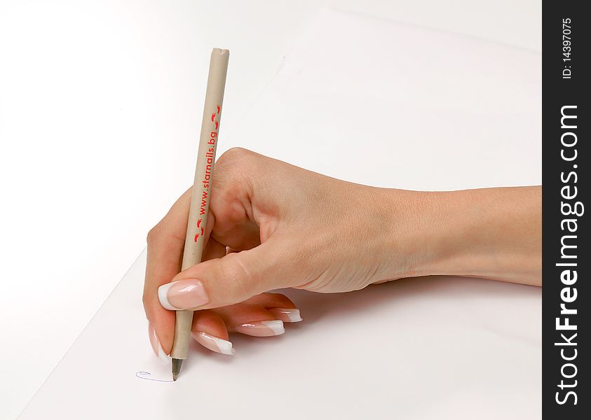 Woman with a french manicure writing on a blanc paper list. Woman with a french manicure writing on a blanc paper list.