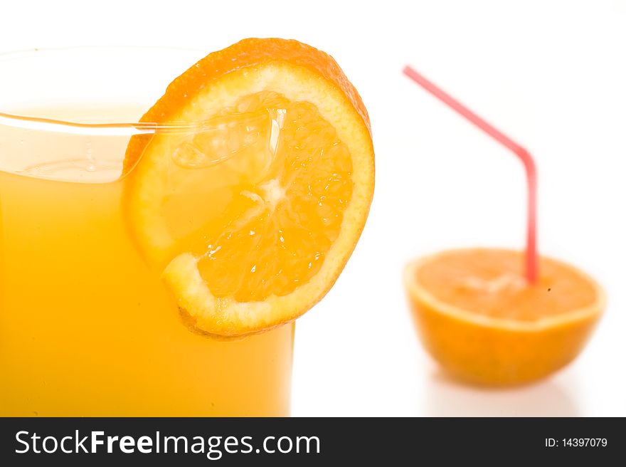 Orange with orange juice in front of white background