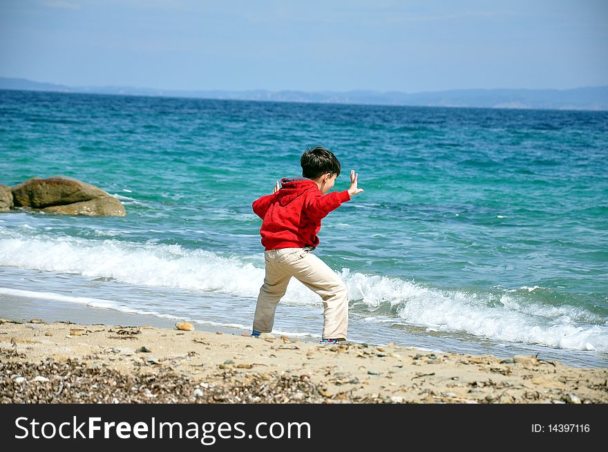 Young boy by the sea. Young boy by the sea