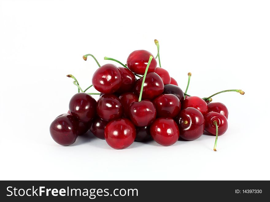 Heap of sweet cherries isolated on white