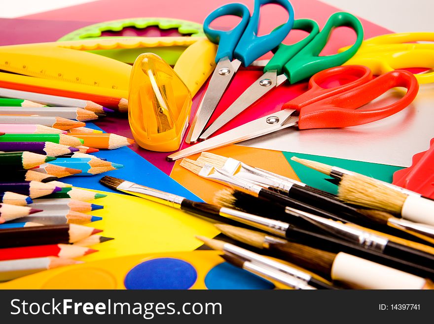 Colorful pencils lying on colorful cardboard sheets. Colorful pencils lying on colorful cardboard sheets