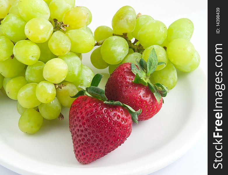 Fresh delicious strawberries green grapes. Fresh delicious strawberries green grapes