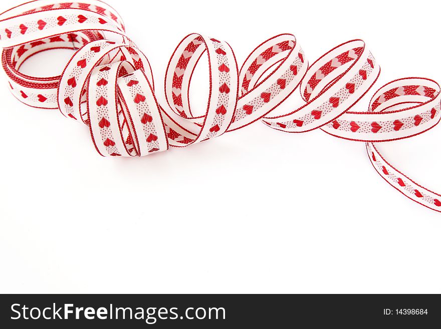 Ribbon with red hearts isolated on a white background