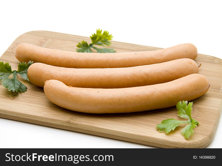 Sausage with parsley on edge board