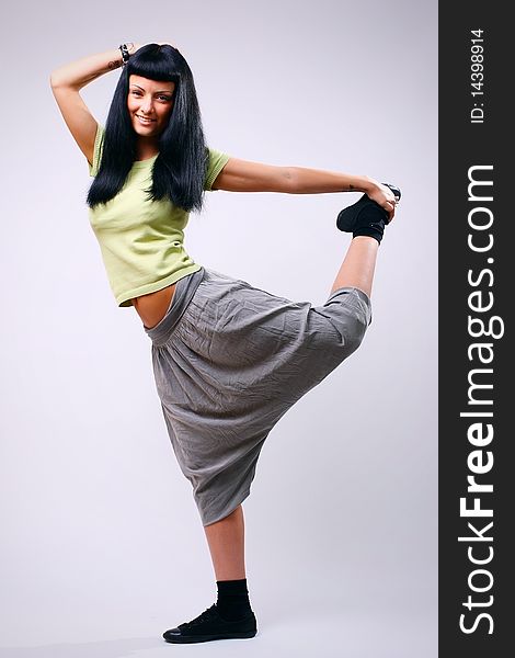 Young beautiful woman dancer - studio portrait