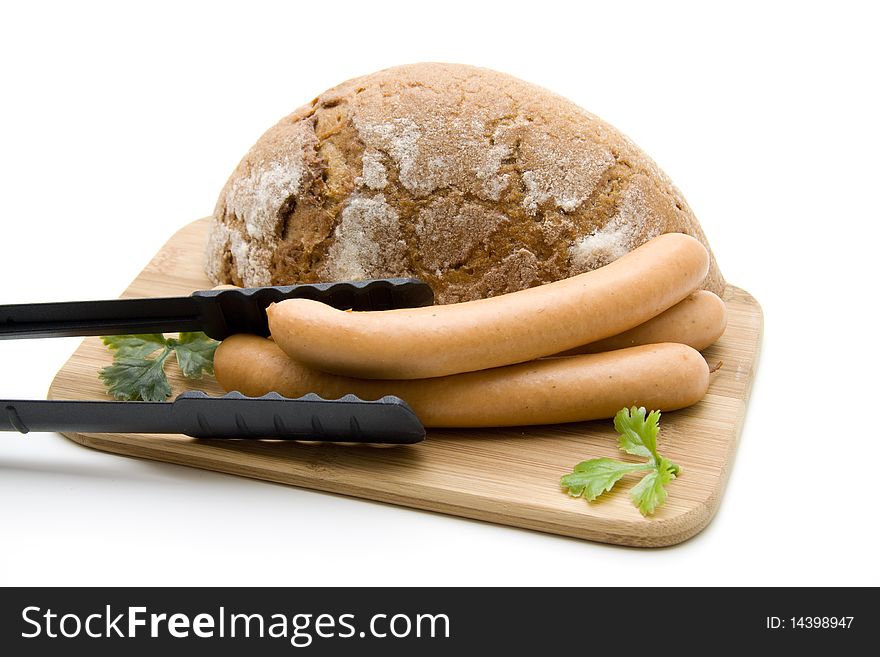 Sausage with and bread on edge board. Sausage with and bread on edge board
