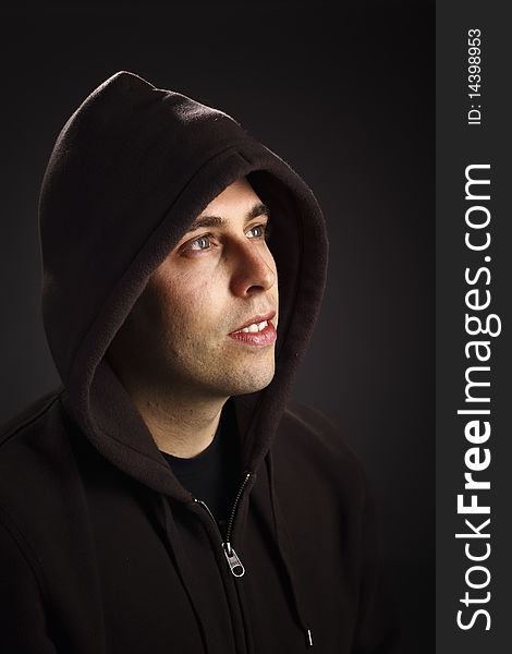 Fashion young caucasian  male portrait on dark background. Fashion young caucasian  male portrait on dark background