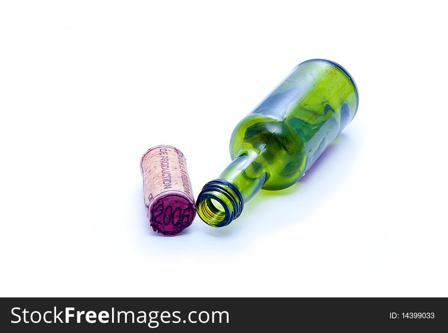 A green glass bottle and cork