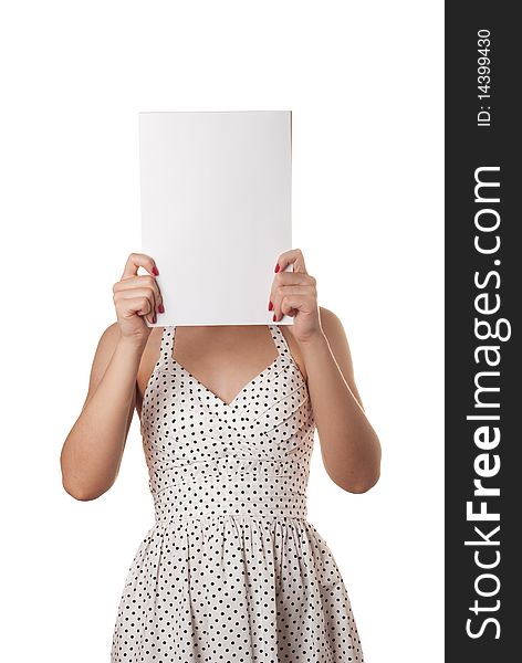 Young woman in white summer dress with the blank sheet of paper over his face isolated on white. Young woman in white summer dress with the blank sheet of paper over his face isolated on white