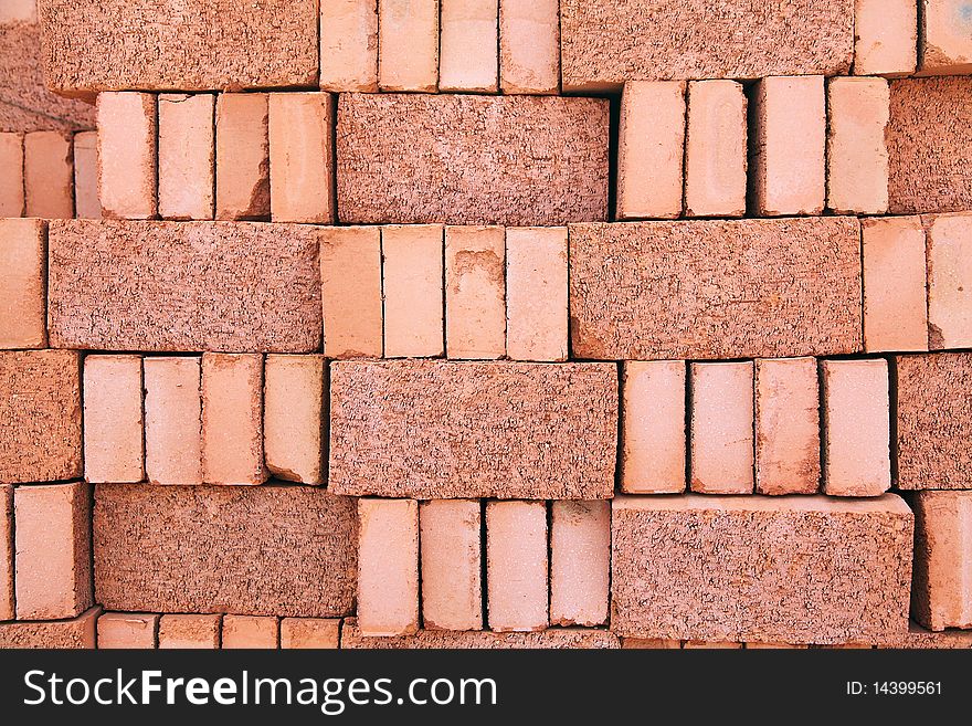 A stack of new red bricks. A stack of new red bricks