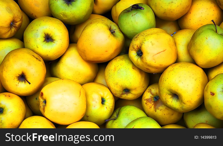 Photo of yellow apples on the market