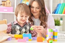 Free Woman And Boy Playing Lego Game Royalty Free Stock Image - 143919586
