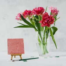 Vase With Tulip Flowers ,paintbrush With Color On A Canvas Painting And Mosaic On Gray Backround Stock Images