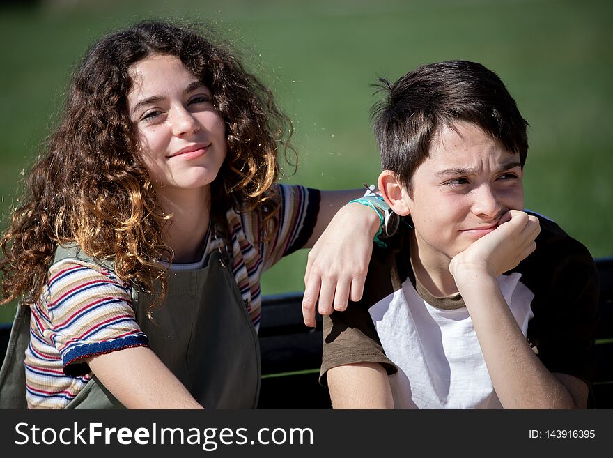 Brothers sitting posing in the field