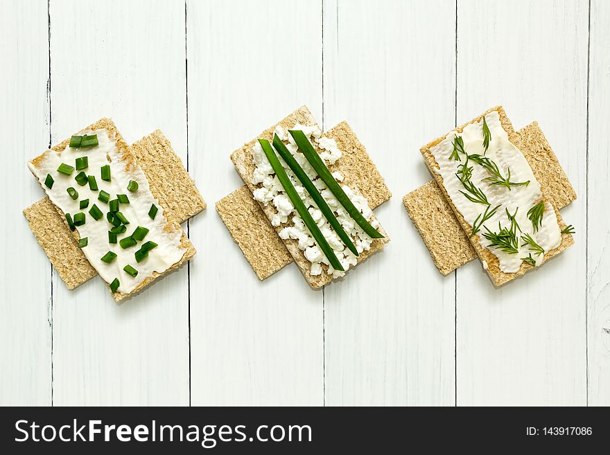 Three dietary breakfasts with cottage cheese on a white wooden table, sign of prohibition.