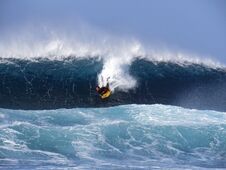 Surfer Riding Huge Atlantic Waves Stock Images