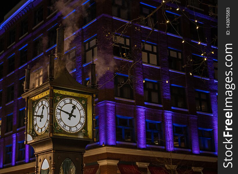 Amazing lit background around the historic Gastown Steamclock in Vancouver BC. Amazing lit background around the historic Gastown Steamclock in Vancouver BC.