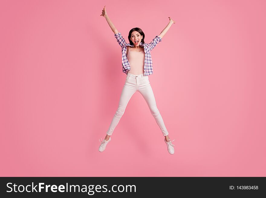 Full length body size photo funny amazing beautiful her she lady star shape figure jumping high wear shoes casual checkered plaid shirt white jeans denim clothes outfit isolated pink background.